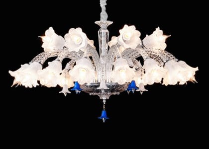 A 24-light luxury K9 crystal chandelier with a tiered design and cascading pendants in a grand dining room.