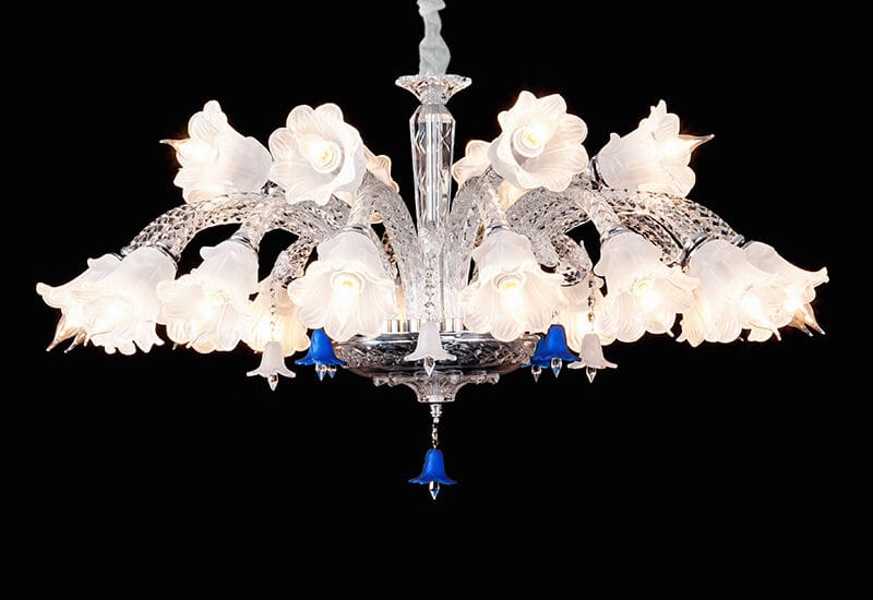 A 24-light luxury K9 crystal chandelier with a tiered design and cascading pendants in a grand dining room.