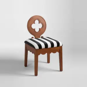 Perspective view of a Walnut-finished Rubberwood Dining Chair with a quatrefoil backrest and black and white striped seat.