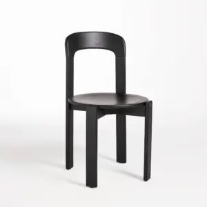 Front-side view of a Walnut finish solid rubberwood dining chair with a sculptural triple-slat backrest.