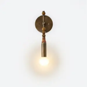 Luxury marble and brass wall sconce with natural stone backplate and integrated LED for hotel decor.