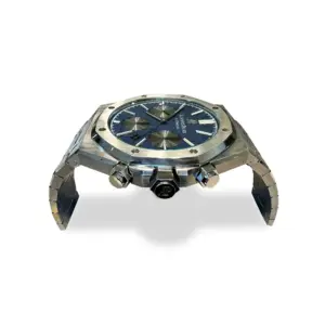 Luxury stainless steel coffee table with an industrial watch-inspired base and tempered glass top for hotel lobbies.