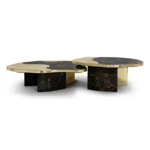 Luxury marble coffee table in black and gold nesting set for high-end hotel lobby.
