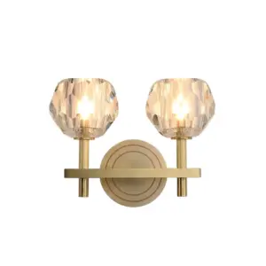 Luxury champagne gold iron wall sconce with faceted crystal shades and LED lighting for hotel interiors.