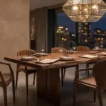 Modern luxury dining room featuring a solid wood live-edge table and leather upholstered dining chairs with shell-back design under a geometric pendant light.