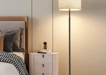 Modern minimalist metal floor lamp with linen fabric shade for luxury hotel decor.