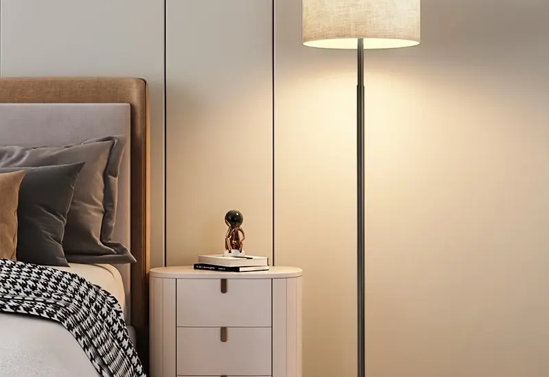 Modern minimalist metal floor lamp with linen fabric shade for luxury hotel decor.