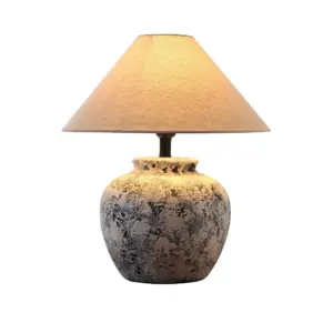 Granite grey ceramic table lamp with conical fabric shade and smart control options for luxury hotels.