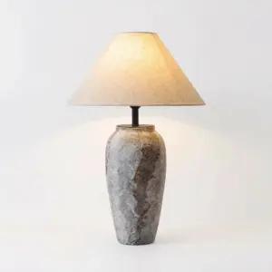 Modern grey textured ceramic table lamp with tan conical shade for luxury hotel decor.