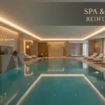 Modern luxury indoor spa and wellness area design by RST featuring a calm water pool, stone fountain, and relaxation lounge for hospitality projects.