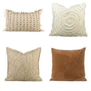 Artisan Textural Throw Pillow collection in neutral cream and camel tones with fringe and spiral details.