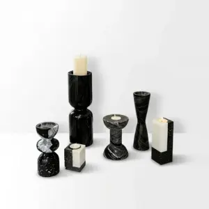 Luxury custom marble candle holder set in natural black stone for hotel interior decoration.