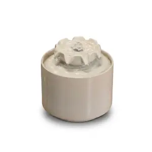Artisanal Minimalist Zen Ceramic Water Fountain in white, black, and blue finishes with bubbling water effect.