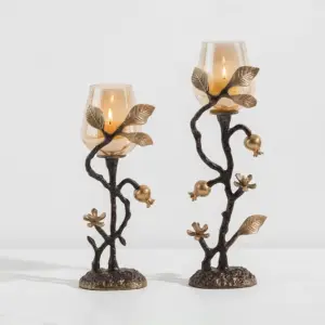 Luxury custom gold aluminum candle holder with a black textured stem and gold accents for hotel lobby decoration.