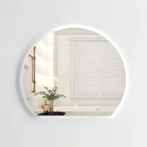 Luxurious Modern Backlit LED Mirror with soft glowing edges in a contemporary hotel bathroom.