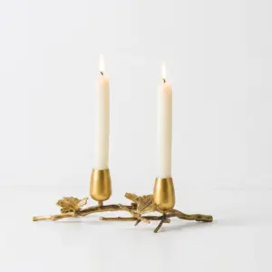 Luxury custom copper candle holder with a fluid gold-tone organic shape for high-end hotel tabletop decoration.