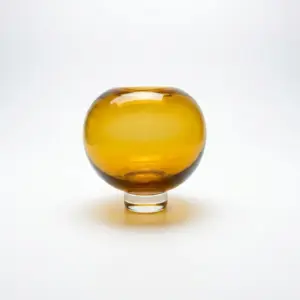 Handcrafted amber and deep brown Liuli glass vase with a rounded silhouette and polished finish.