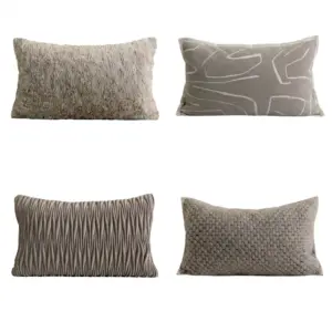 Grey Artisan Textured Lumbar Throw Pillow collection in various 3D geometric relief patterns for luxury hotel decor.