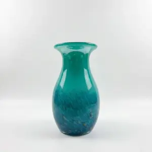 Handcrafted Peacock Blue Liuli glass vase with internal plume textures.