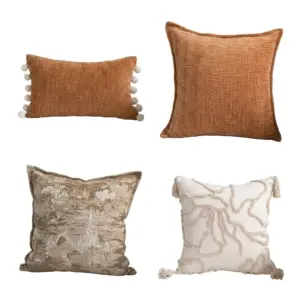 A collection of four Customizable Textured Decorative Pillows in terracotta, landscape print, and tufted cream styles.
