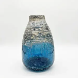 Handcrafted deep azure Liuli glass vase with a fluid organic silhouette and polished finish.
