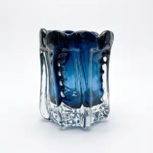Handcrafted ripple textured Liuli glass vase in translucent blue and green with scalloped edges.