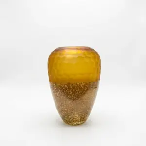 Handcrafted amber and blue Liuli glass vase with fluid internal patterns and a polished finish.