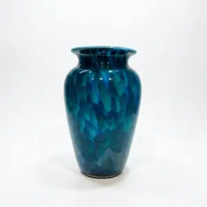 Handcrafted deep azure Liuli glass vase with a tall elegant silhouette and vibrant blue color.