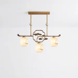 Luxury brass and alabaster 3-light chandelier with pine-motif design for high-end hotel interiors.