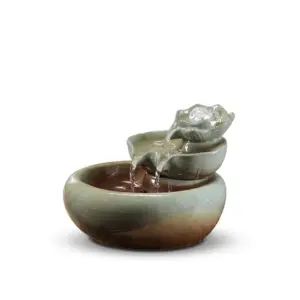 Artisanal Lotus Blossom Zen Ceramic Water Fountain with rotating crystal ball and tiered petal design in black and blue glaze.
