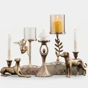 Luxury custom gold metal candle holder in various geometric and architectural designs for hotel tabletop decoration.