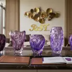 Handcrafted amethyst Liuli glass vases displayed in a luxury hotel lounge, featuring intricate purple crystal textures for high-end interior design projects.