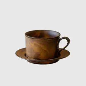 Luxury customizable artisan brown ceramic coffee cup and saucer set with tactile reactive glaze pattern for premium hospitality dinnerware and high-end home decor by RST.