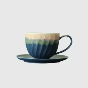 Luxury customizable blue ceramic coffee cup and saucer set with vertical twisted fluted texture for premium hospitality dinnerware and high-end home decor by RST.
