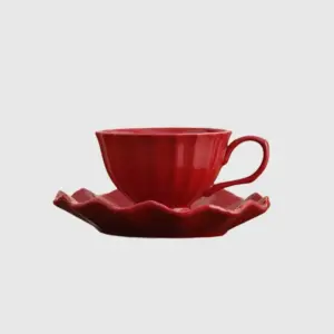 Luxury customizable fluted red ceramic coffee cup and saucer set with vertical fluted texture and scalloped wavy edges for premium hospitality dinnerware and high-end home decor by RST.
