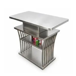 Modern brushed stainless steel commercial bar table with integrated storage shelves, side view.